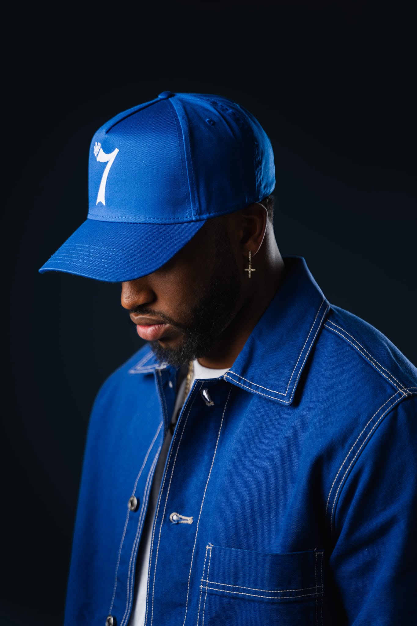 JayDubb Tha Ruler profile portrait in blue cap and jacket